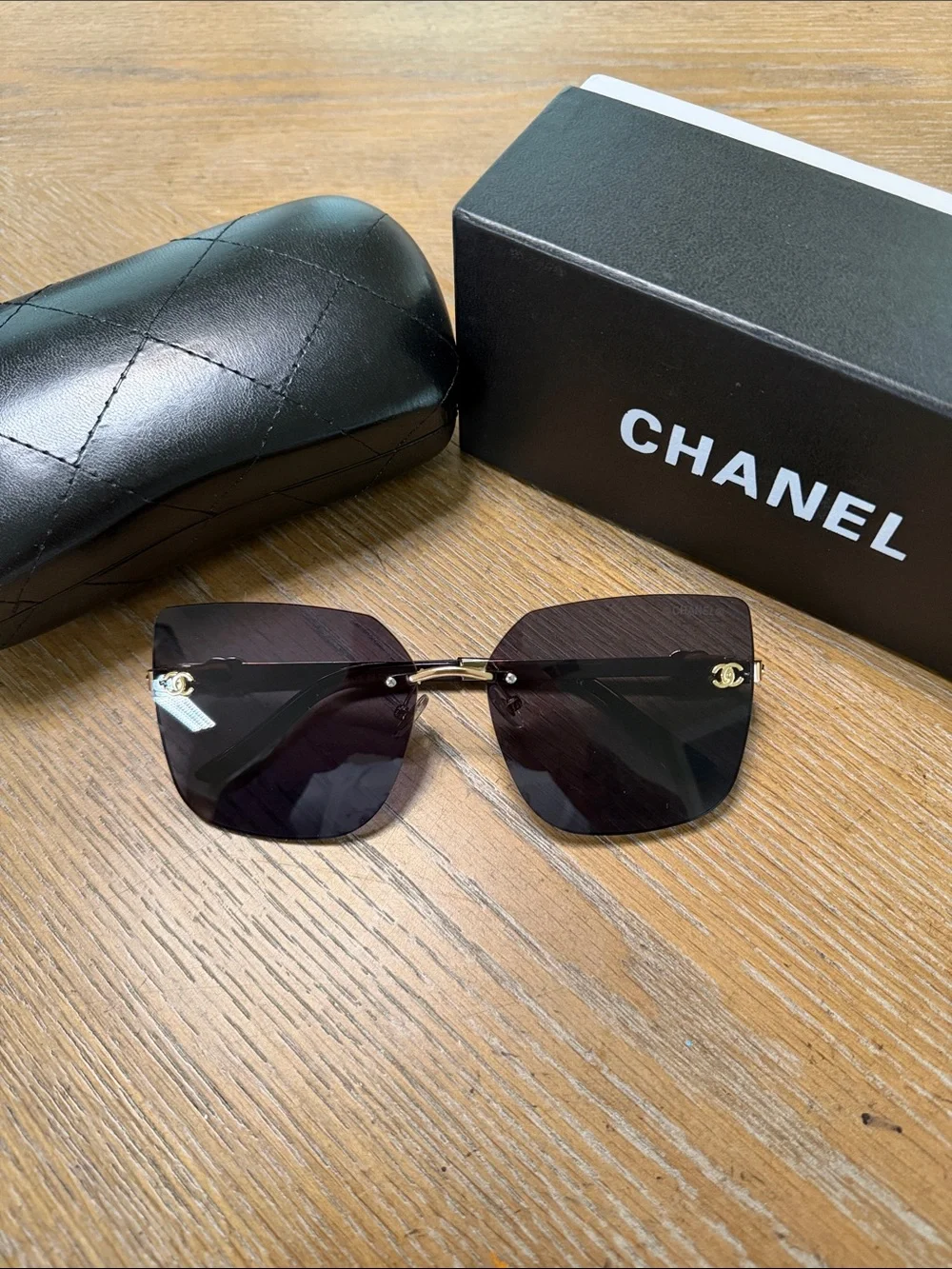CHANEL Rimless Square Sunglasses with Dark Gradient Lenses and Gold Accents